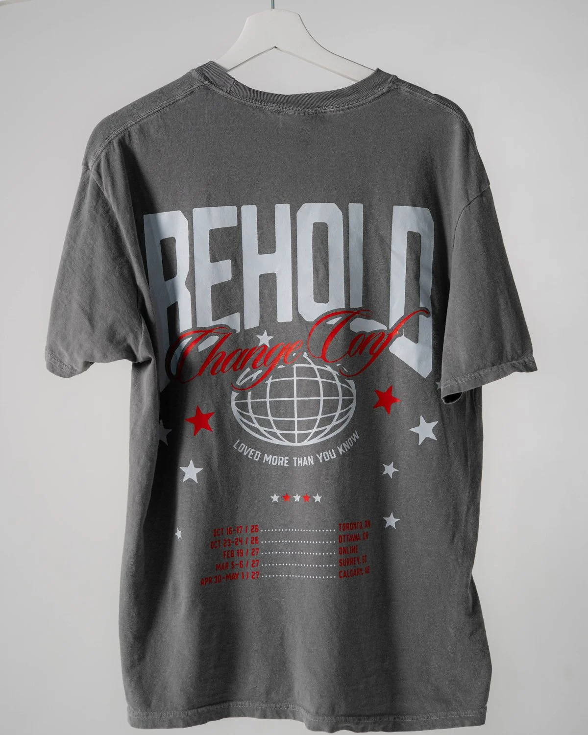 Graphite Behold tour tee, back with the BEHOLD Change Conf artwork and tour dates